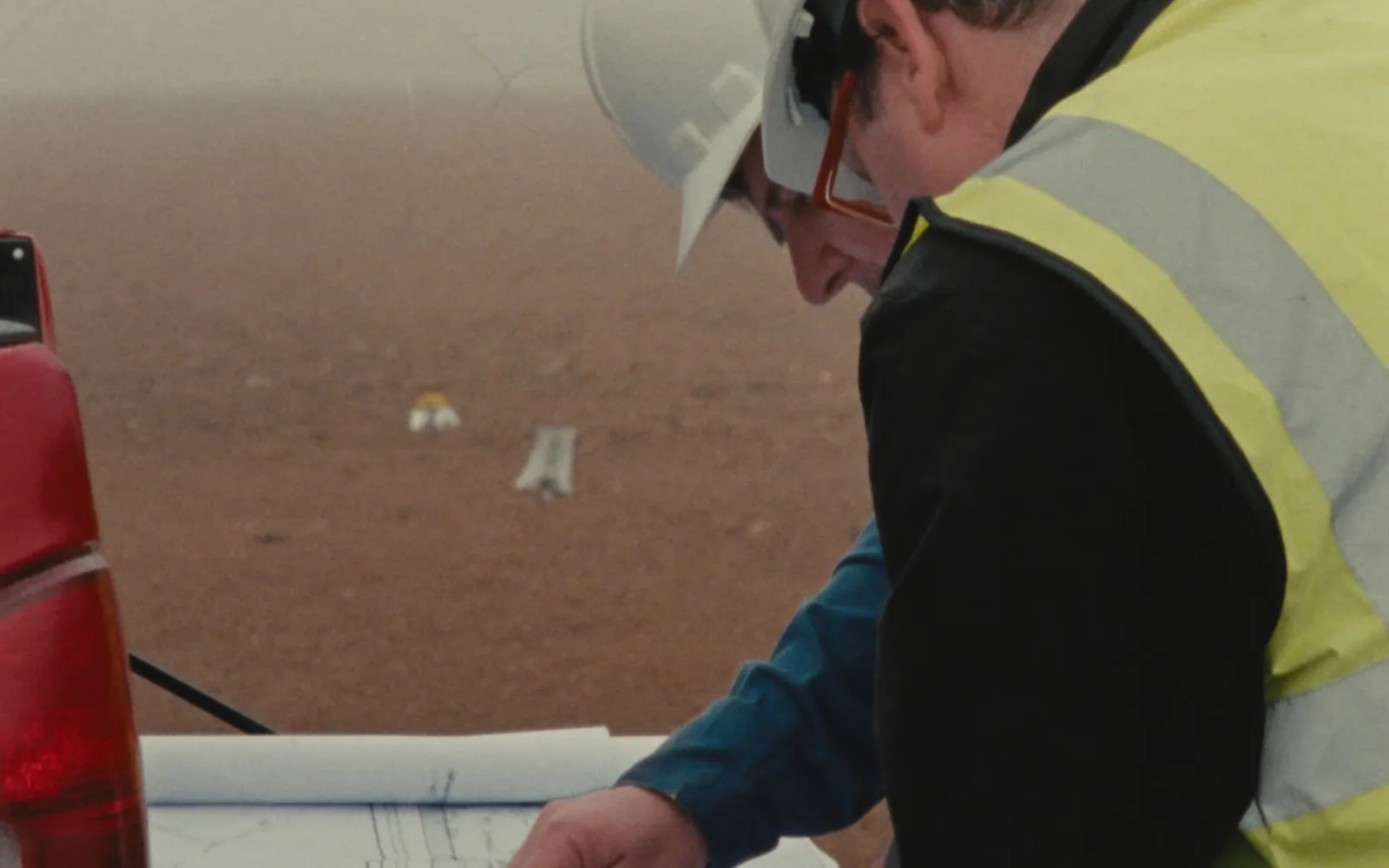 Industrial site enabling works with crew reviewing drawings in County Wicklow