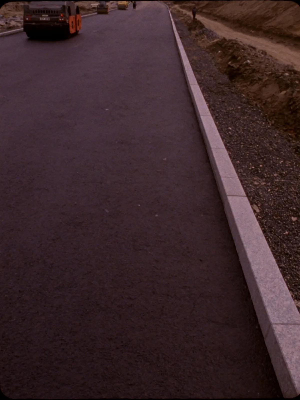Kerb laying and macadam surfacing on new estate road